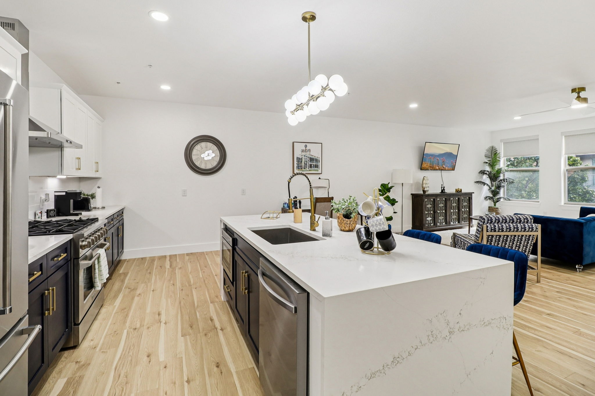 Navy double vanity bathroom with gold fixtures