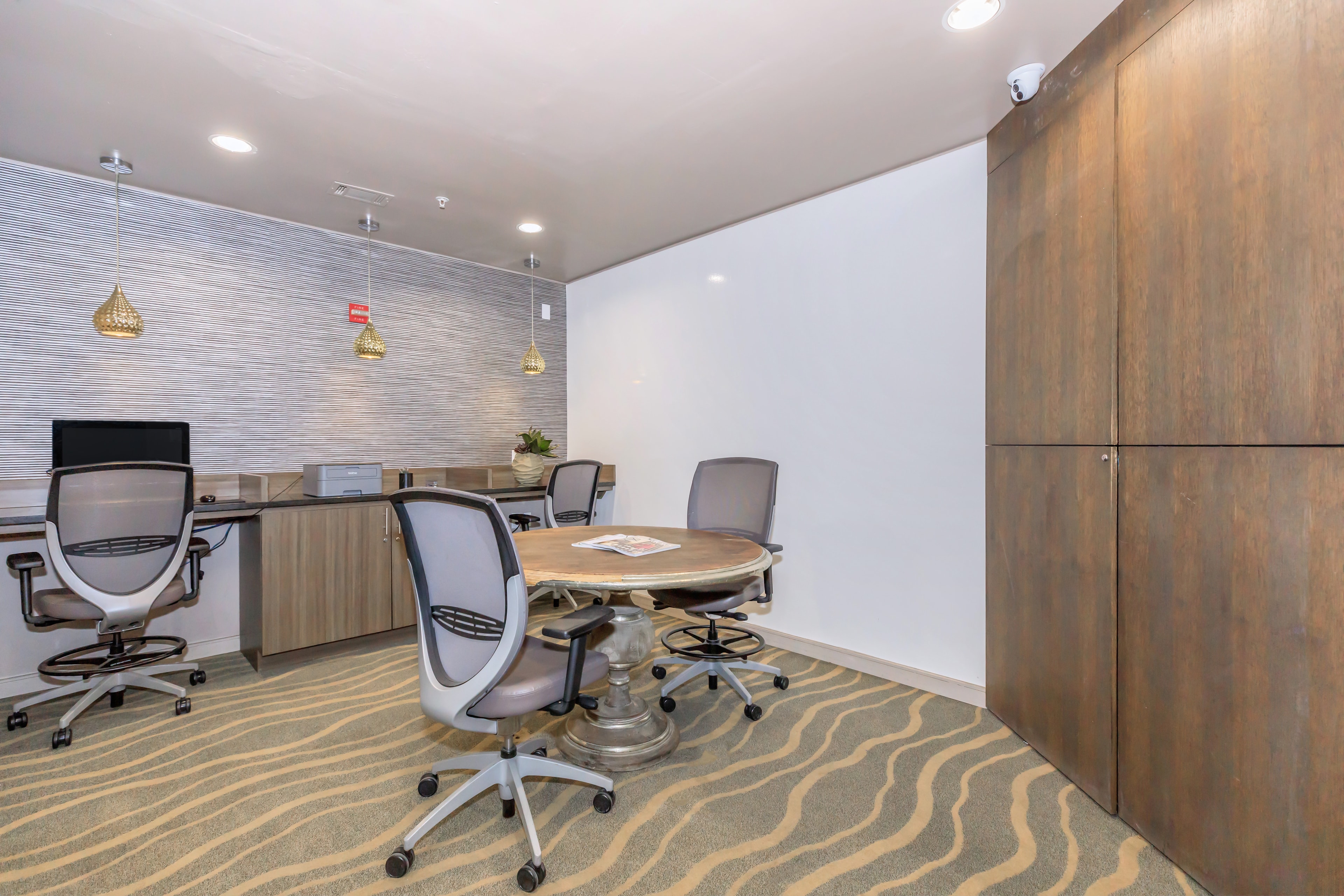 Business center with workstations and conference table