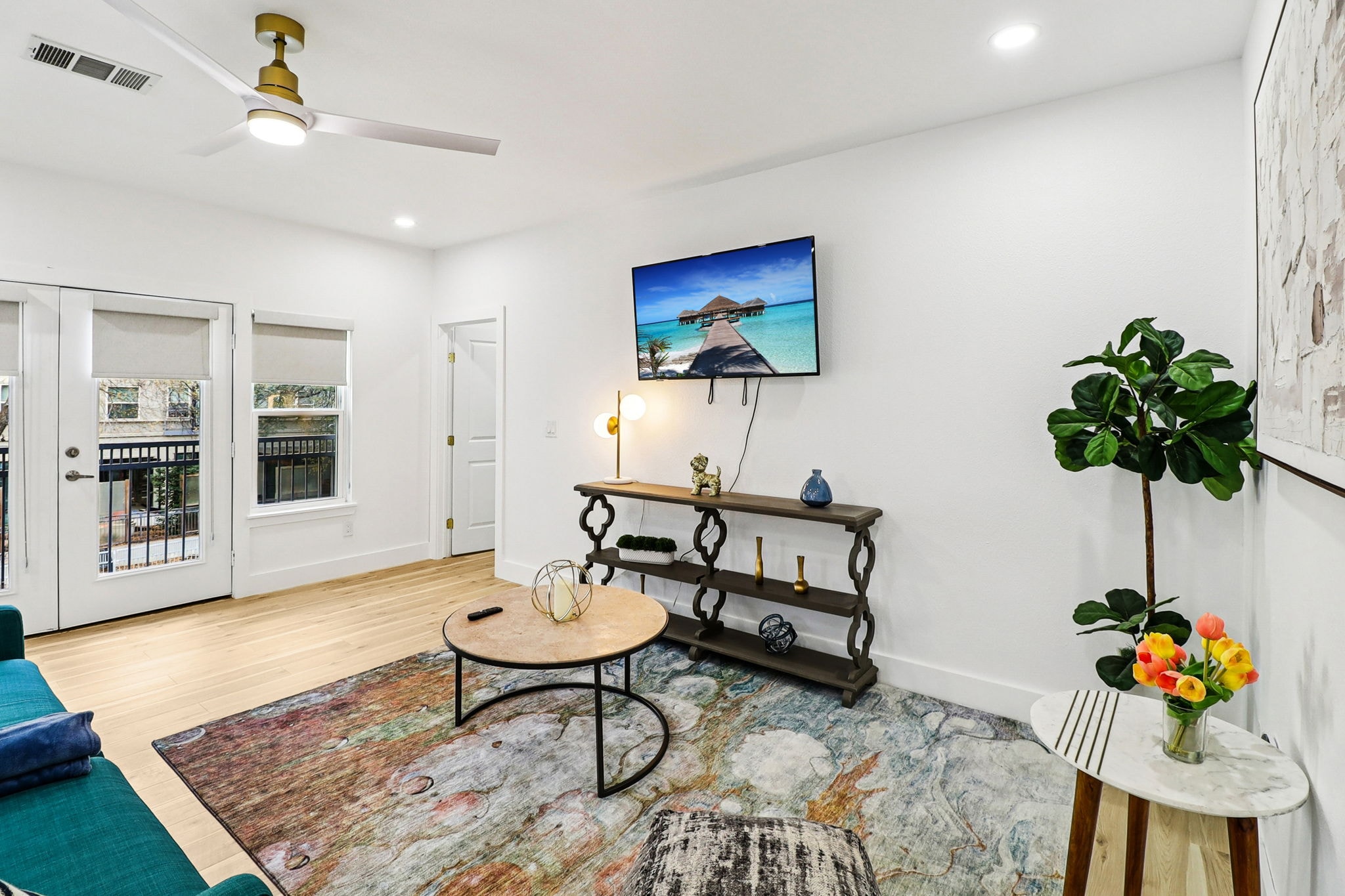 Kitchen with marble island and blue bar stools
