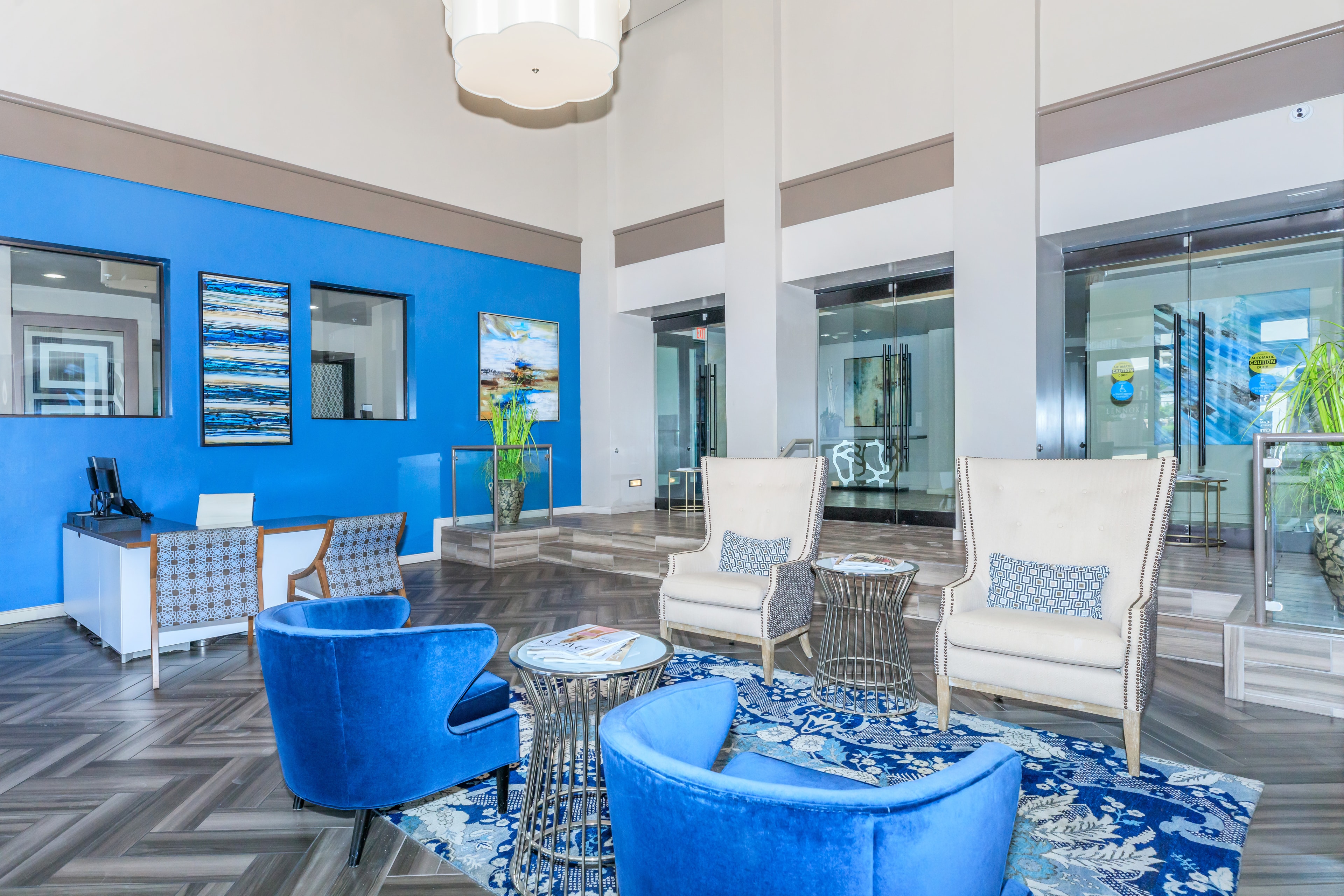Grand lobby with blue accent wall and designer seating