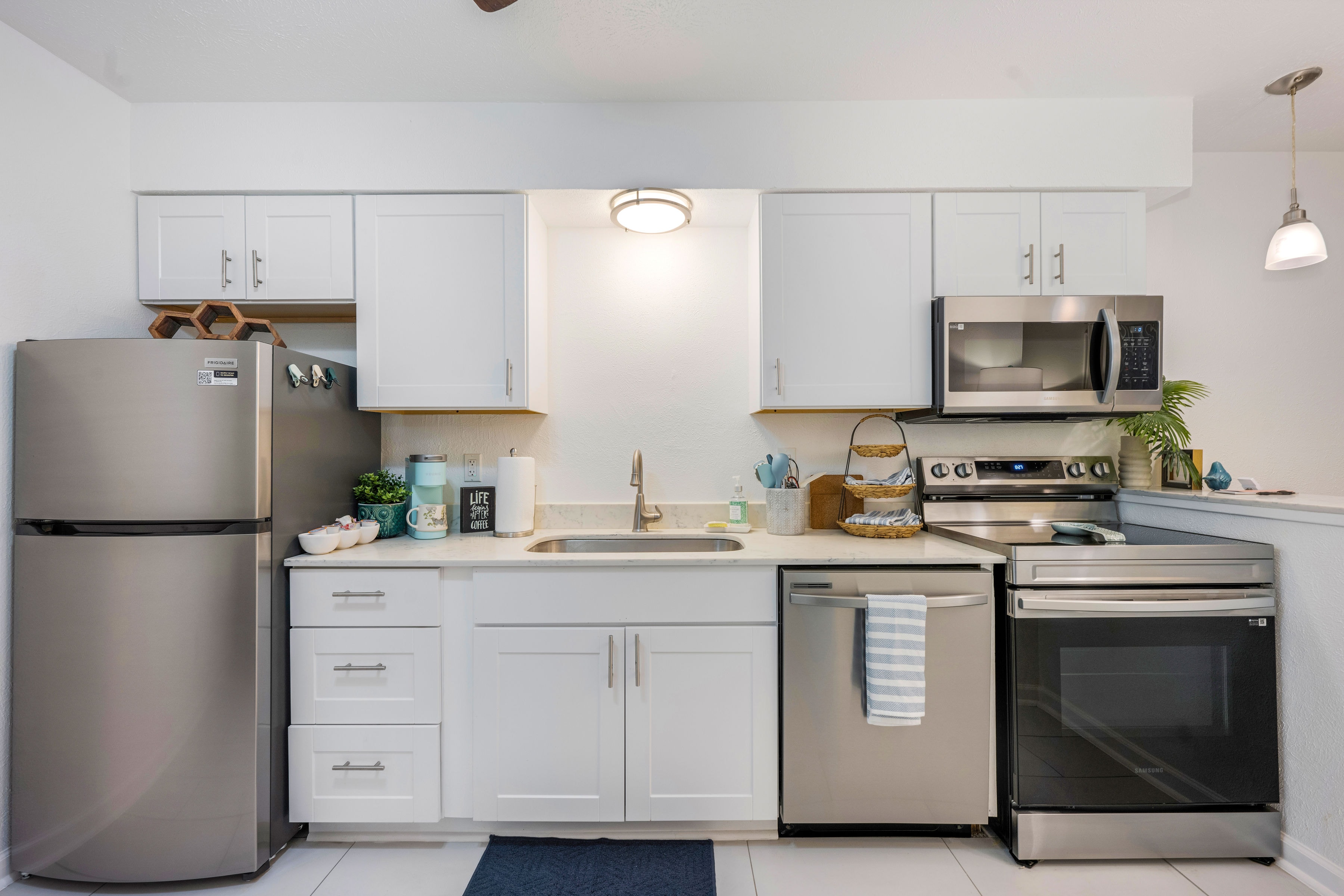 Kitchen with white cabinets and stainless steel appliances