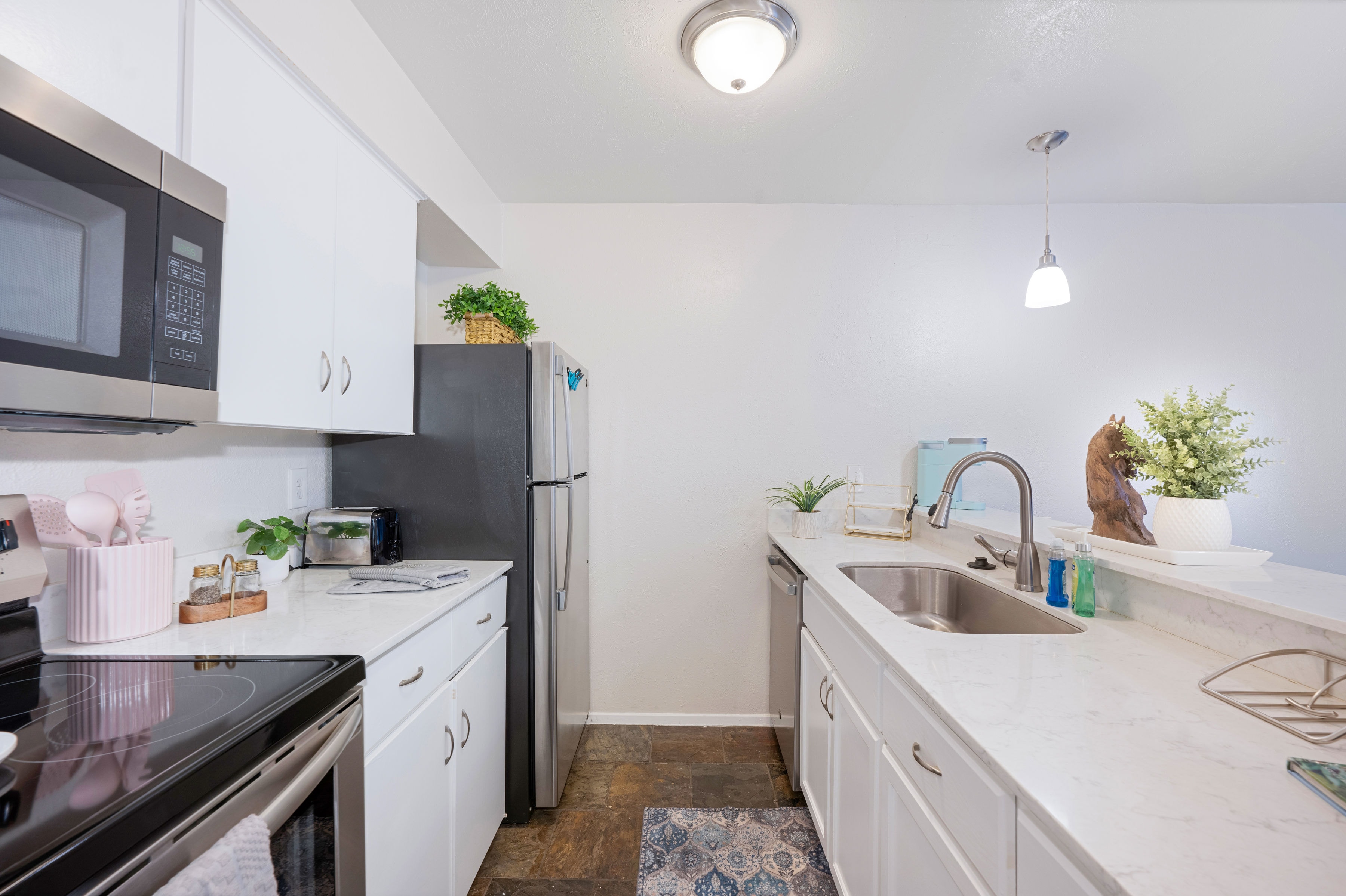 Kitchen with white cabinets and stainless appliances