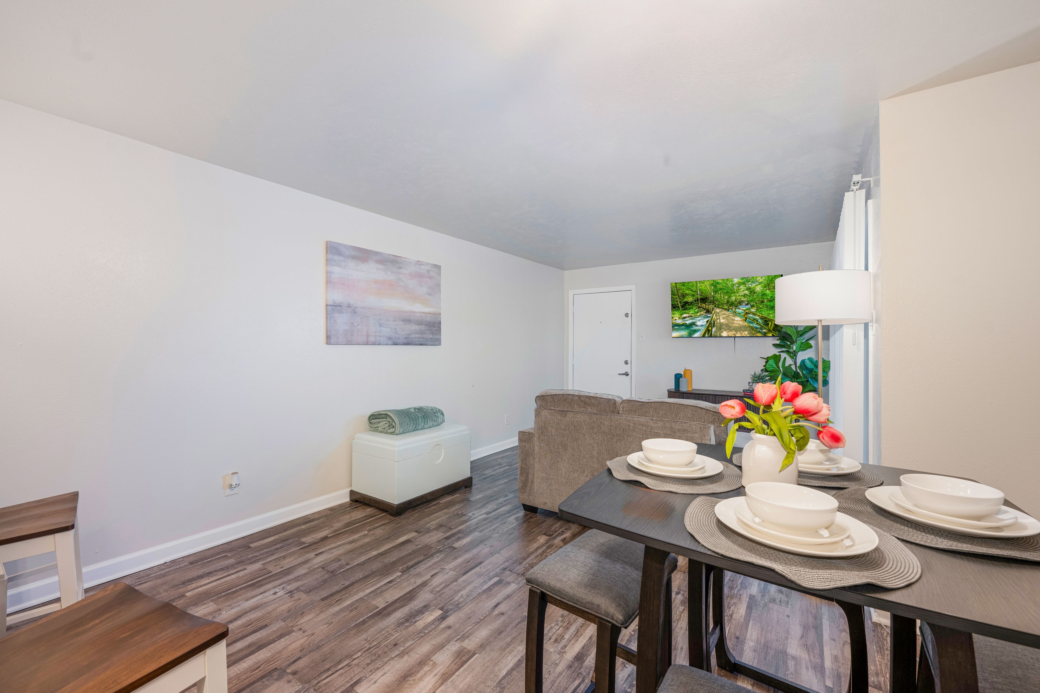 Open living and dining area with hardwood floors